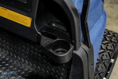 Black plastic golf cart cup holder.