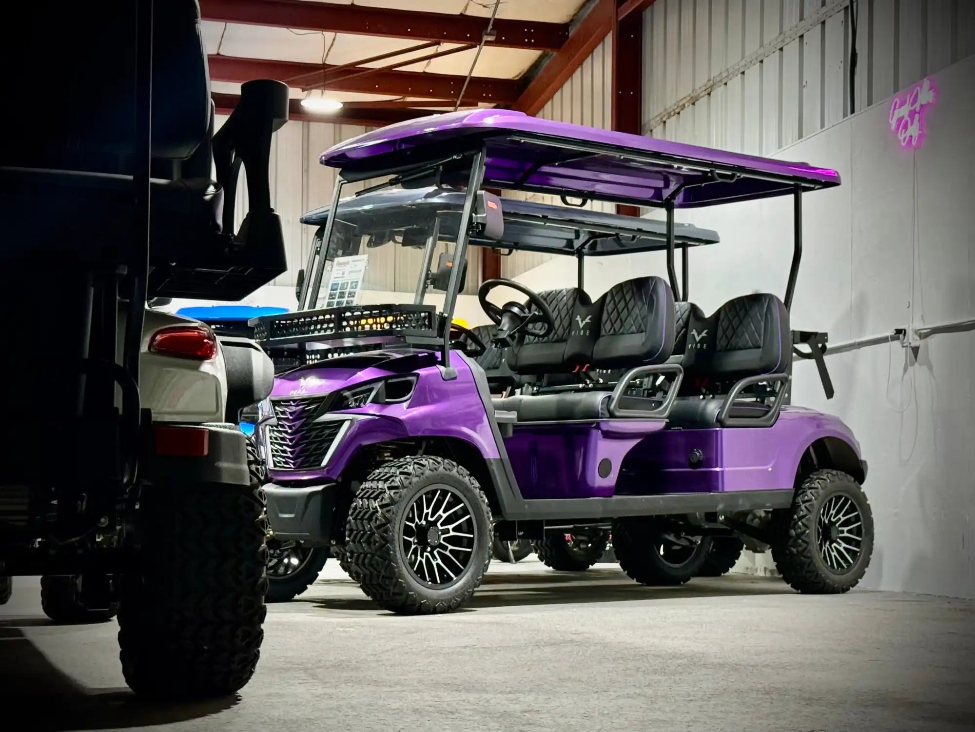 Purple six-seater golf cart.