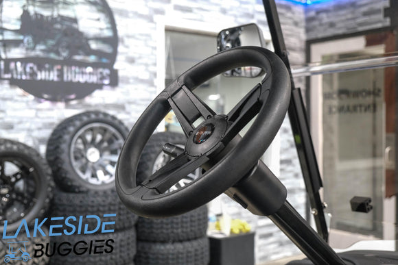 Black golf cart steering wheel.