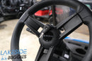 Black golf cart steering wheel.