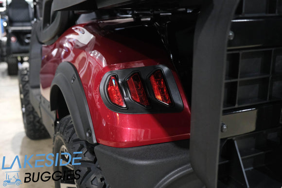 Maroon golf cart with black accents.