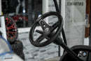 Black golf cart steering wheel.