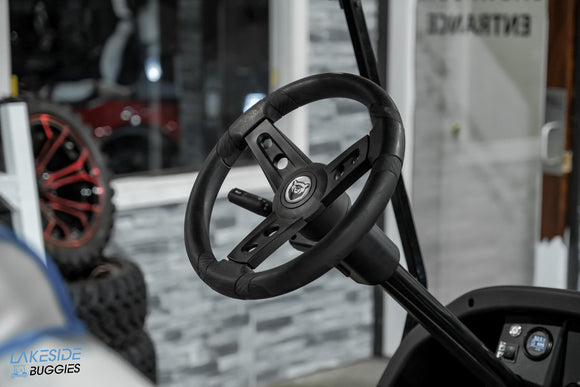 Black golf cart steering wheel.
