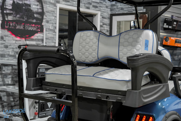 Golf cart seat with armrests.