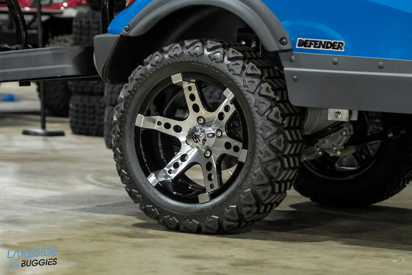 Blue golf cart with custom wheels.