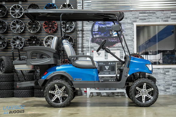 Blue lifted golf cart.