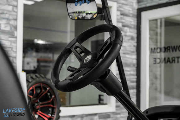 Black golf cart steering wheel.