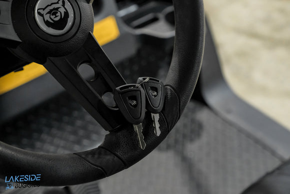 Black steering wheel with keys.
