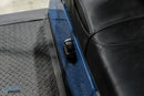 Blue golf cart seat with switch.