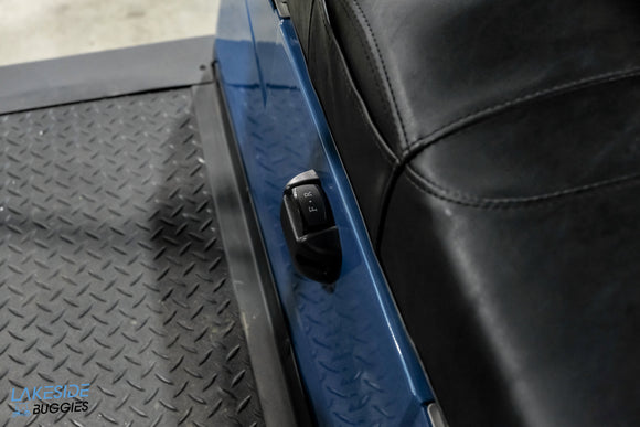 Blue golf cart seat with switch.