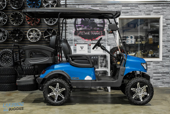 Blue golf cart with custom wheels.