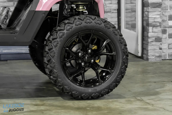 Black off-road tire and rim.