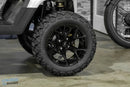 Black off-road tire and rim.