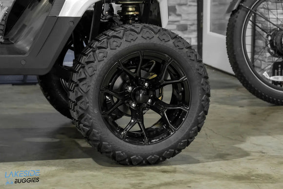 Black off-road tire and rim.
