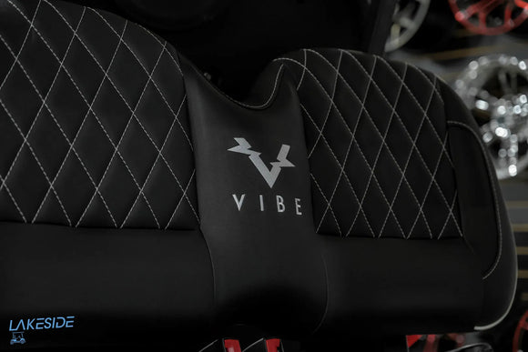 Black quilted golf cart seat.