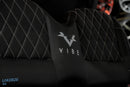 Black quilted seat with ’Vibe’ logo.