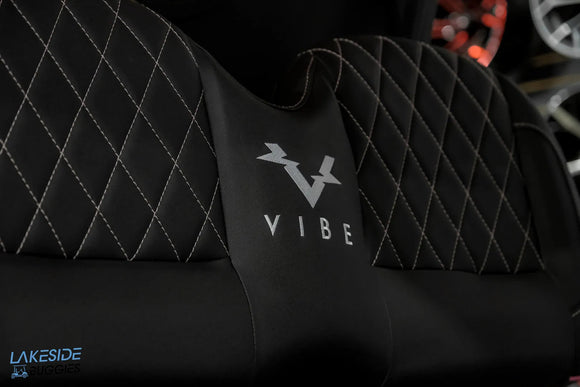 Black quilted seat with ’Vibe’ logo.