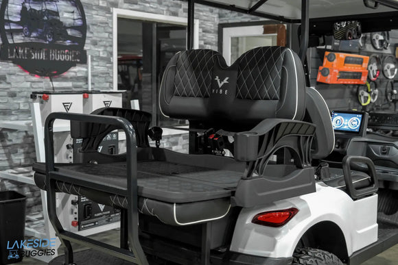 Golf cart with rear seat.