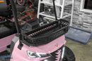 Pink golf cart with black front basket.