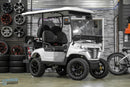 White golf cart with black wheels.