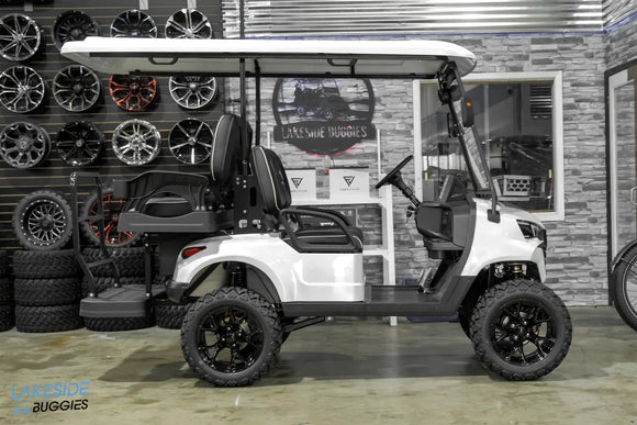White lifted golf cart.