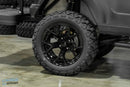 Black off-road tire and rim.