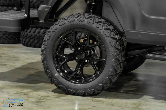 Black off-road tire and rim.
