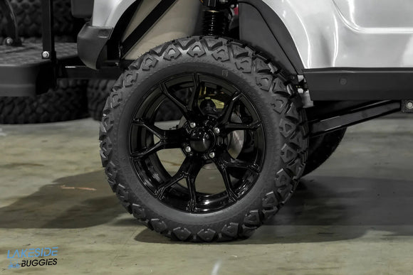 Black off-road tire and rim.