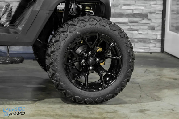 Black off-road tire and rim.