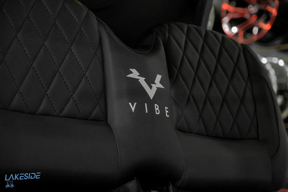 Black quilted golf cart seat.