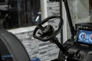 Golf cart steering wheel and dashboard.