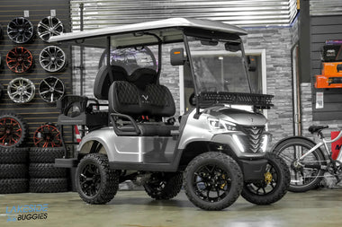 Silver golf cart with black wheels.