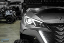 Silver golf cart with illuminated accents.