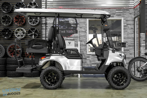 Silver lifted golf cart.