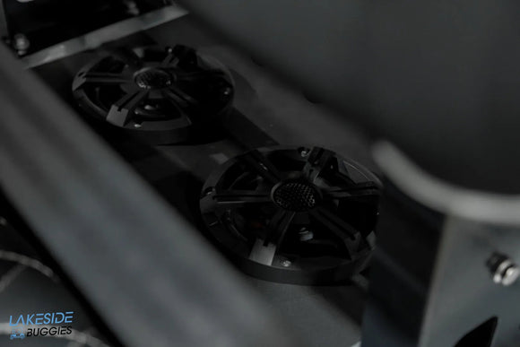 Two black circular speakers.