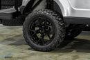 Black off-road tire and rim.