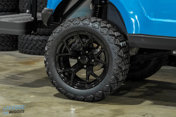 Black off-road tire and rim.
