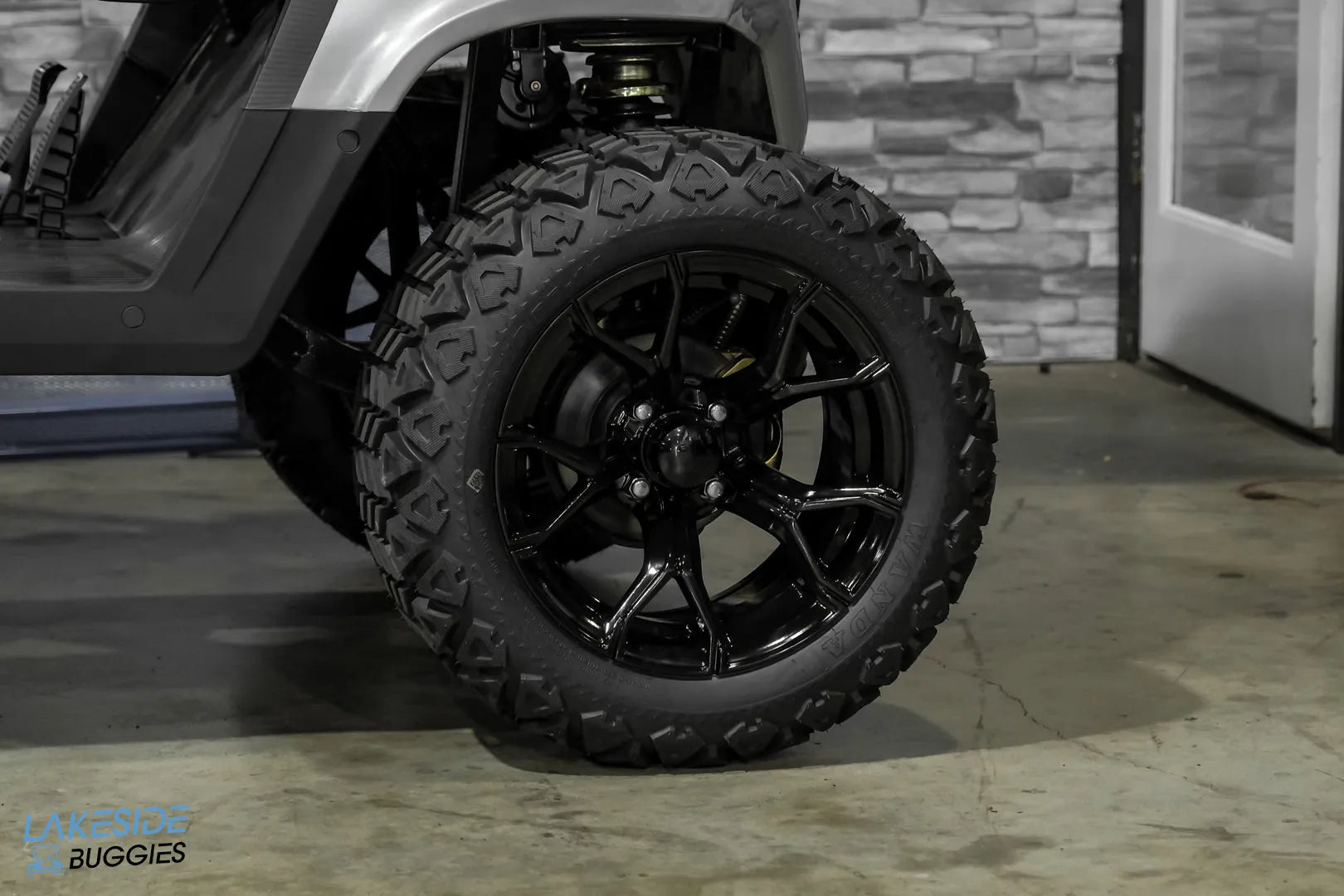 Black off-road tire and rim.