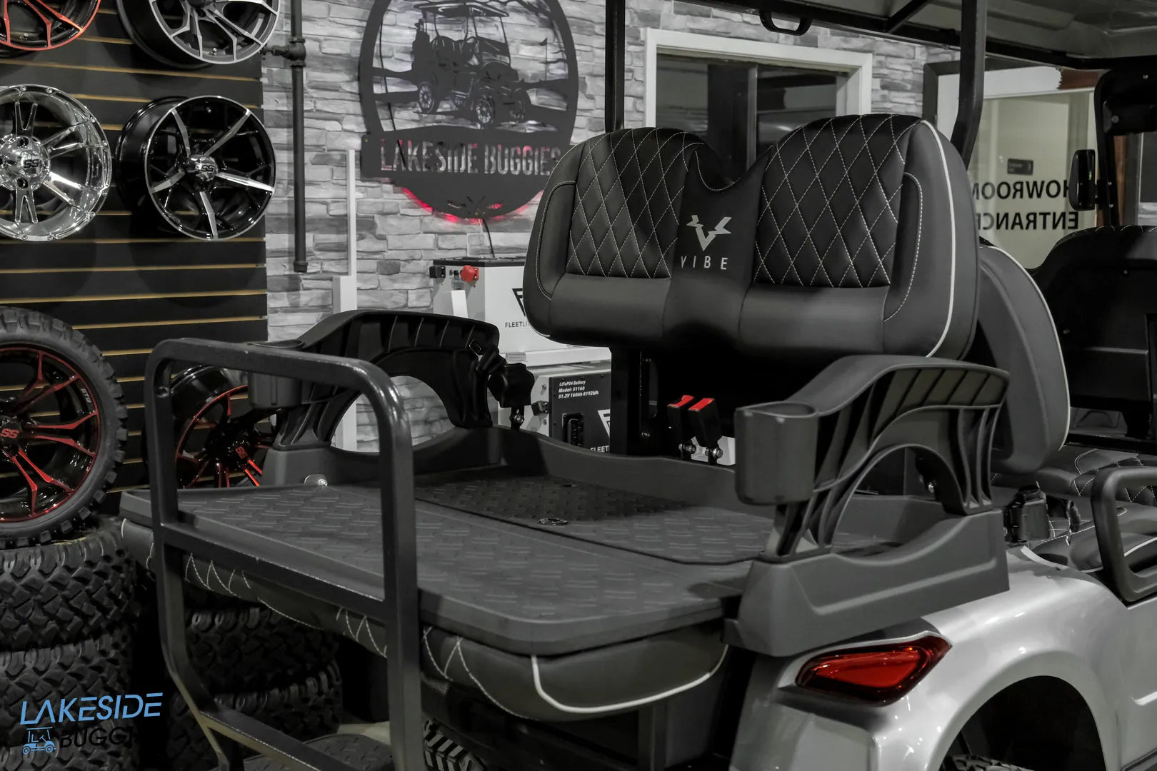 Gray golf cart rear seat.