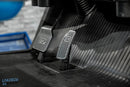 Metal pedals labeled ’STOP’ and ’GO’.
