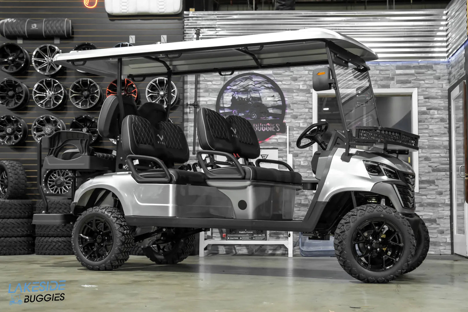 Silver six-seater golf cart.