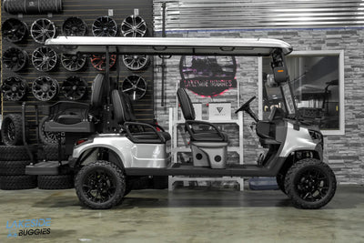 Silver six-seater golf cart.