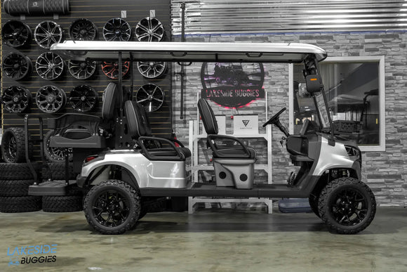 Silver six-seater golf cart.