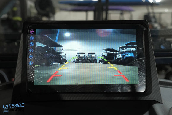 Rearview monitor displaying golf carts.