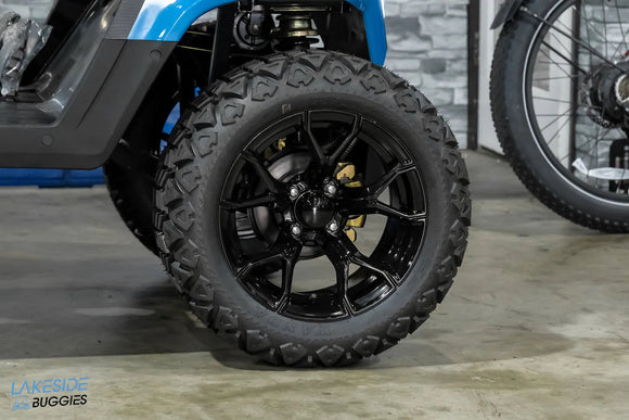 Black off-road tire and rim.
