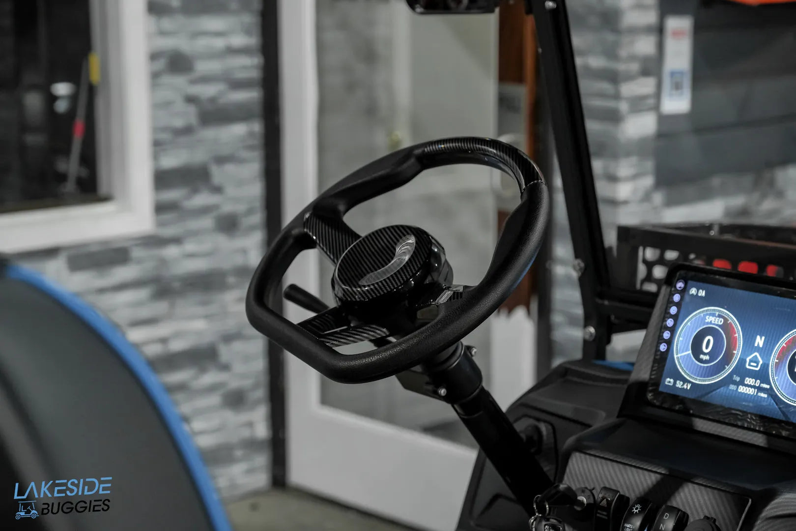 Black golf cart steering wheel.
