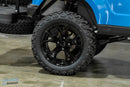 Black off-road tire and rim.
