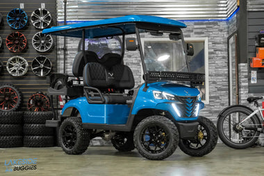Blue golf cart with black wheels.