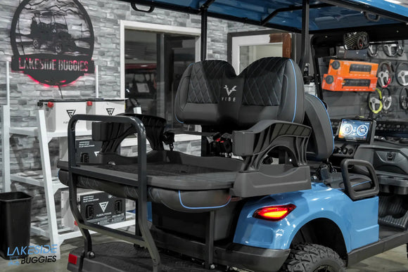 Blue golf cart with rear seat.