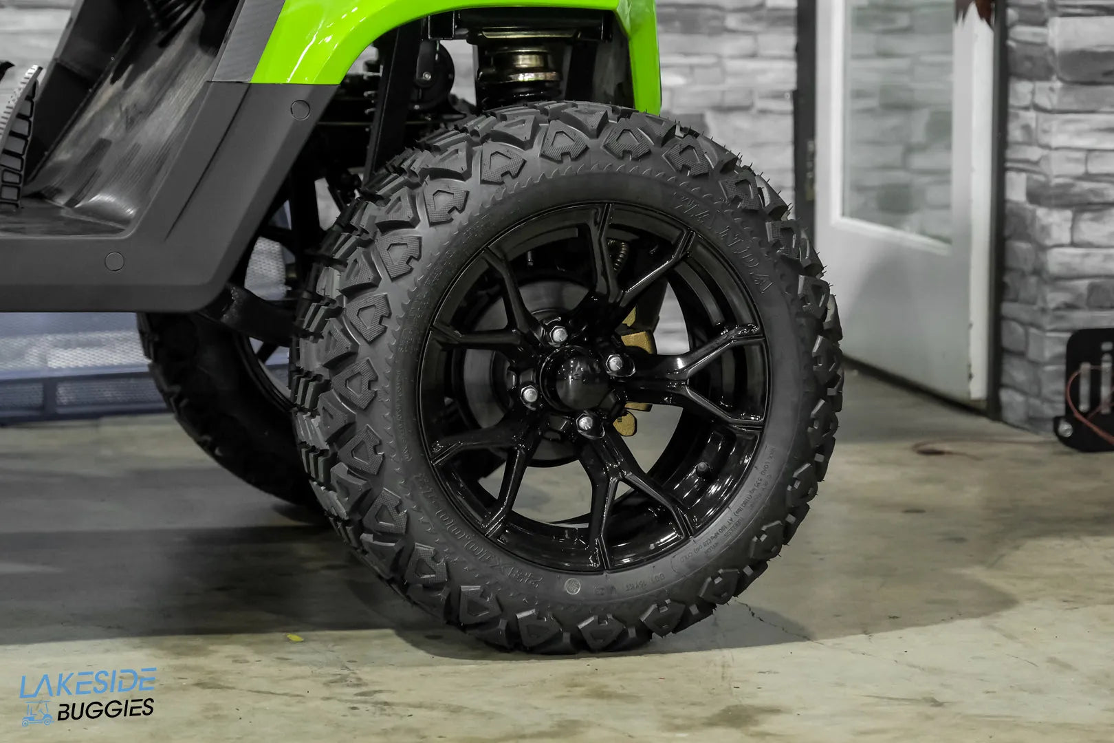 Black off-road tire and rim.